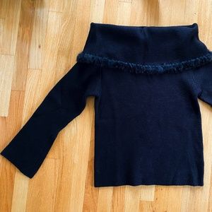 Women's black off the shoulder sweater with fur trim